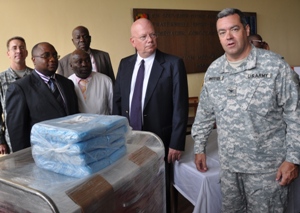 Ambassador James Entwistle presents a sample donation to the Minister of Health, Felix Kabange. (State Dept. Images)