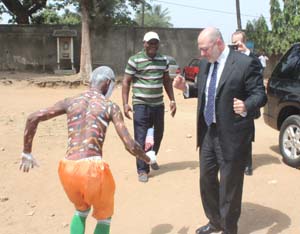 Ambassador J. Adam Ereli is greeted as he arrives at Lycee Municipal Pierre Gadie in Yopougon