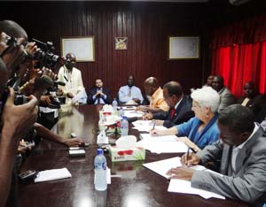 Ambassador Malac and Liberian officials sign a $9.1 million agreement between the U.S. Government and the Liberia Electricity Corporation to expand the distribution of electricity to 7,000 more customers in Monrovia.
