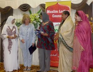 Ambassador receiving a book from Counci Member.