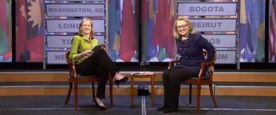 Secretary Clinton and Leigh Sales share a joke with the audience on stage at the live Global Town Hall.