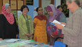 Dr. Davis reviews Secondary school textbooks. (U.S. photo)