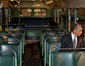 President Obama sits on the Rosa Parks bus at the Henry Ford Museum in Dearborn, Michigan.