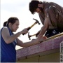 Habitat for Humanity volunteers work on
 a roof in San Antonio (AP Photo).
 