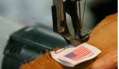 american flag label being sewn onto a piece of cloth (AP Photo)
