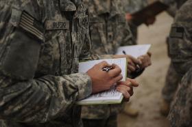 Issues at a Glance graphic showing soldiers taking notes