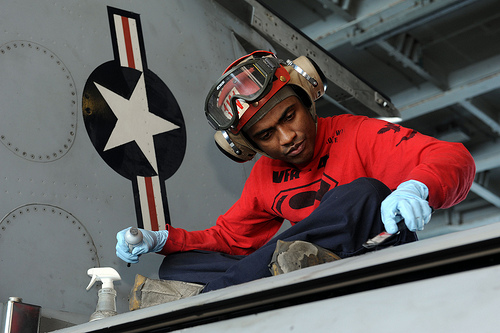 <p>130207-N-QI595-073 U.S. 5TH FLEET AREA OF RESPONSIBILITY (Feb. 07, 2013) - Aviation Ordnanceman 3rd Class James Rice, from Dallas, applies sealant to an F/A-18F Super Hornet from the Black Aces of Strike Fighter Squadron (VFA) 41 in the hangar bay aboard the aircraft carrier USS John C. Stennis (CVN 74). John C. Stennis is deployed to the U.S. 5th Fleet area of responsibility conducting maritime security operations, theater security cooperation efforts and support missions for Operation Enduring Freedom. (U.S. Navy photo by Mass Communication Specialist Seaman Marco Villasana / Released)</p>