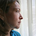 Photo of a woman looking out