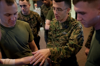 Face of Defense: Navy Corpsman Shares Skills With Marines