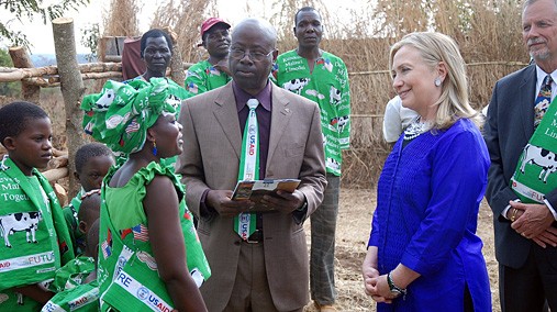 Dairy farmer Margaret Chinkwende explains her work to U.S. Secretary of State Hillary Rodham Clinton and Martin Banda of the U.S. Agency for International Development (USAID) in Lilongwe, Malawi, August 5, 2012. [State Department photo/ Public Domain]