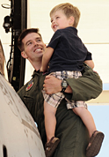photo of serviceman holding son