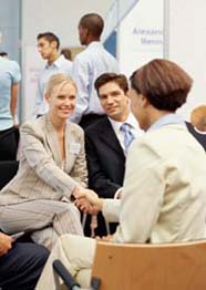 Businesswomen shaking hands at a meeting
