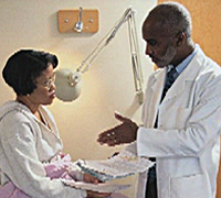 A photo of a physician and patient
