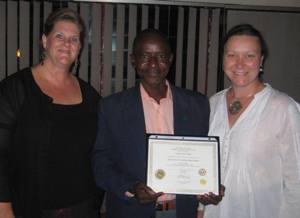 
English teacher Georges Zanga receives his ATDOP certificate from the University of Oregon