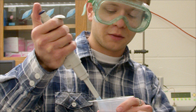 picture of boy doing experiment