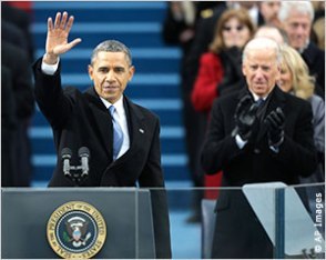 At the 57th U.S. presidential inauguration on the Capitol steps in Washington, President Obama waves after his inaugral address while Vice President Biden applauds(Photo Credit: AP)