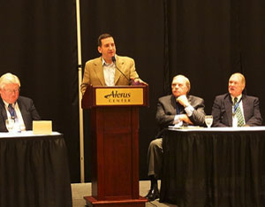 U.S. Consul Tim Cipullo speaks to the Red River Basin Commission annual conference in Grand Forks, ND, January 23. L-R: RRBC Chairman Jon Evert, Mr. Cipullo (at podium), RRBC Past-Chairman Morrie Lanning, RRBC Executive Director Lance Yohe.