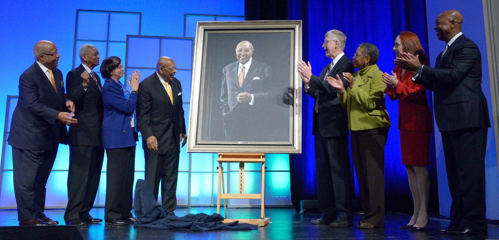 A portrait honoring former Rep. Louis Stokes is unveiled at the summit.