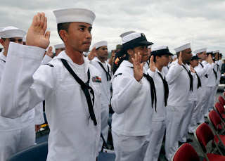 On May 20, 2011, USCIS Seoul Field Office Director Kenneth Sherman presided during a naturalization ceremony on the USS Essex at the Sasebo Naval Base in Japan for 46 sailors, Marines and military family members. (U.S. Navy photo)