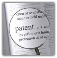 Magnifying glass over a dictionary definition of patents