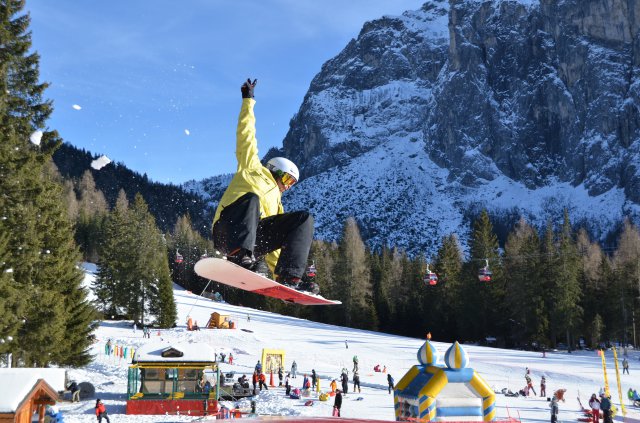 Chris Wolff, Vicenza Outdoor Recreation snowboard instructor, demonstrates how to fly through the air.