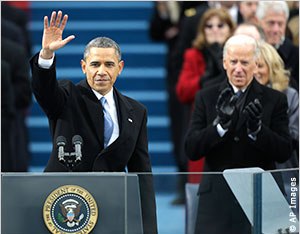 At the 57th U.S. presidential inauguration on the Capitol steps in Washington, President Obama waves after his inaugural address while Vice President Biden applauds. (Photo AP)