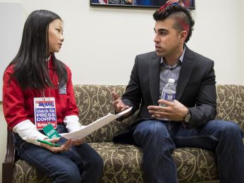 Bobak Ferdowsi, Flight Director, Mars Curiosity Rover, answers questions from Scholastic News young reporter Emily Shao prior to the start of the first-ever State of Science, Technology, Engineering and Math Event (SoSTEM) held at the Eisenhower Executive Office Building, Wednesday, Feb. 13, 2013.