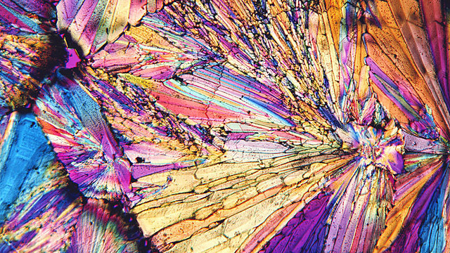 [crystals viewed under polarising microscope]