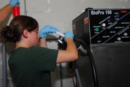 Jessika Blersch, the sustainability coordinator for the Florida National Guard's Camp Blanding Joint Training Center, pumps methanol into a biodiesel processor while processing vegetable oil from the installation's Consolidated Dining Facility into biodiesel. The cleaner-burning biodiesel is used to fuel state maintenance vehicles and saves the Guard money while also reducing the amount of waste that comes out of the installation. Photo by Sgt. 1st Class Blair Heusdens