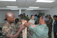 Members of the Antiguan Defense Force practice dressing wounds during a combat lifesaver course given by members of the Florida National Guard's 256th Medical Company. The Florida Guardsmen recently traveled to the Eastern Caribbean nation of Antigua to train members of their defense forces. Photo by 2nd Lt. Gavin Rollins