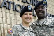 Pfcs. Samantha and Joseph James of the 1218th Transportation Company pose for a photo outside of the unit's armory in West Palm Beach, Fla., July 1, 2009. The James' are one of the three married couples - all truck drivers - who are deploying with the unit in support of Operation Iraqi Freedom. Photo by Tech. Sgt. Thomas Kielbasa