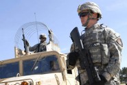 fc. Terry Barefoot (right) of 631st Maintenance Company provides security for a convoy of Humvees at a fuel point during training in Ft. McCoy, Wis., Aug. 24, 2009. Spc. Jose Ramos of the 631st is seated in the turret of the Humvee. Photo by Tech. Sgt. Thomas Kielbasa