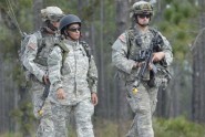 Roleplayer and interpreter Nawal Al-Saedi (center) patrols with members of the Florida National Guard's B Company, 2nd Battalion, 124th Infantry Regiment, during a training exercise at Camp Blanding Joint Training Center, Fla., Oct. 26. Al-Saedi, a former Iraqi interpreter for the U.S. military, is part of a group at Camp Blanding helping the Soldiers prepare for a 2010 deployment to Southwest Asia. Photo by Tech. Sgt. Thomas Kielbasa