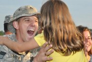 Sgt. Samuel Carey of the 779th Engineer Battalion is reunited with his family at Fort Stewart, Ga., May 19, 2010, following a year-long deployment in support of Operation Iraqi Freedom. Photo by Debra Cox
