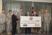 Maj. Gen. Emmett R. Titshaw, the Adjutant General of Florida (far right) stands with members of the Florida National Guard Foundation board and representatives from Kangaroo Express after accepting a donation of $159,000 from Kangaroo Express on behalf of the Florida National Guard Foundation, Oct. 14, 2011.