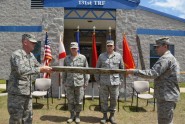 Florida Air National Guard State Command Chief Master Sgt. Robert Lee (left) and Senior Master Sgt. Cory Brown (right) unveil the new official colors for the 131st Training Flight at Camp Blanding Joint Training Center, April 12, 2012. Commander of the Florida Air National Guard Brig. Gen. Joseph Balskus (second from left) and 131st Commander Maj. John Waltbillig also participated in the afternoon ceremony, during which the Florida Air National Guard's Weather Readiness Training Center (WRTC) was deactivated, and replaced, as the 131st Training Flight was activated. Photo by Debra Cox