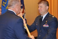 Lt. Col. Daren Van Aulen (right) takes his new unit's guidon from Commander of the Florida Air National Guard Brig. Gen. Joseph Balskus, July 22, 2012, at MacDill Air Force Base. Van Aulen assumed command of the 290th Joint Communications Support Squadron from Lt. Col. Loretta Lombard. Photo by Master Sgt. Thomas Kielbasa