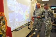 Master Sgt. James Kersey (left) and Sgt. 1st Class Chris Brunner of the 53rd Infantry Brigade Combat Team monitor the track of Tropical Storm Isaac from the Florida National Guard's Joint Emergency Operations Center in St. Augustine, Fla., Aug. 22, 2012. The Florida National Guard was monitoring official forecasts for the storm in anticipation of the storm reaching Florida, and as of Wednesday afternoon the National Hurricane Center predicted Isaac could strike Florida by Aug. 27 as a hurricane. Photo by Master Sgt. Thomas Kielbasa