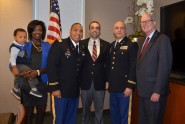 Marylina and Jacquin Gilchrist and their son Jacques-Pierre, family friend Pedro Pavon, Esq., Lt. Col. Kip Lassner of the 164th Air Defense Artillery Brigade and Richard Cole, Esq. (managing partner of Cole, Scott & Kissane, P.A.) celebrate with Capt. Jacquin “Quin” Gilchrist after he is sworn into the Florida National Guard as a Judge Advocate General (JAG) officer.  Photo courtesy of Lt. Col. Kip Lassner.
