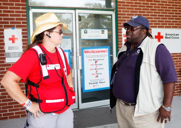 Live Oak, Fla., July 4, 2012 -- FEMA Community Relations Specialist Julius Gibbons works with Red Cross Shelter Manager Marge Gray to better understand the needs of shelter clients and how FEMA and the Red Cross can best partner to assist storm survivors. FEMA is responding to severe flood damage and destruction across Florida caused by Tropical Storm Debby.