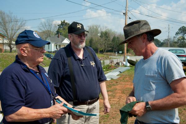 McMinn County, Tenn., March 20, 2012 -- Community Relations Specialist Rico Borrazzo from FEMA and Al Libbrecht with the State of Tennessee meet with survivors of the March tornado. FEMA supports the State and local governments in order to get required information and resources to those who need it.