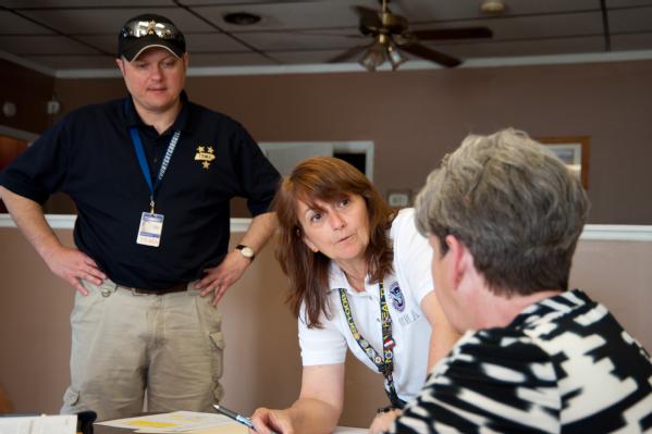 Etowah, Tenn., March 20, 2012 -- FEMA's Julia Hall and TEMA's Roger Thompson go over details on setting up a Disaster Recovery Center with McMinn County Emergency Manager Linda Hamby. Having Disaster Recovery Centers up and running quickly to help survivors is a priority after a disaster has been declared.