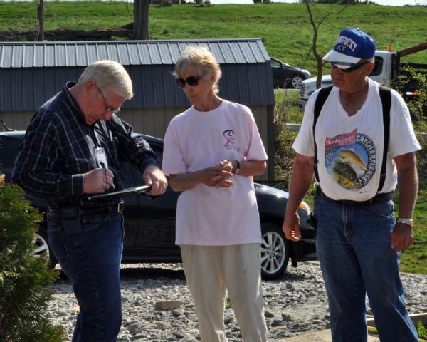 Crittenden, Ky., March 21, 2012 -- Margie and Ron Milner describe the layout of their totally destroyed home to a FEMA Contract Inspector. FEMA sends inspectors to all damaged properties after a disaster survivor has asked FEMA for help.