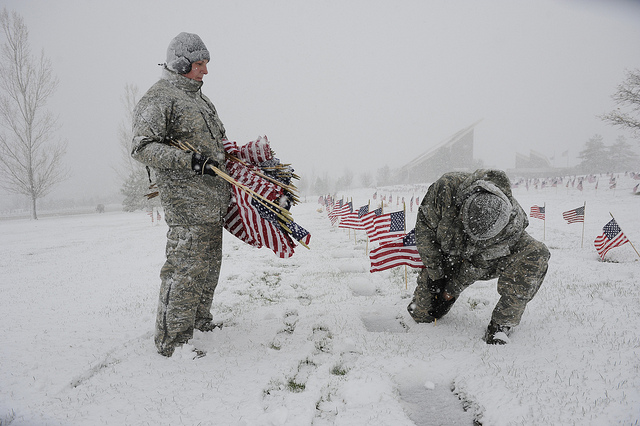 Image description: Tech. Sgt. Sara Bauer and Staff Sgt. Felipe Mendoza place flags above the graves of deceased U.S. military members at the Veterans Memorial Park in Bluffdale, Utah.
A group of volunteers from Hill Air Force Base helped the Memorial Park&#8217;s staff place flags by more than 4,300 deceased U.S. military members’ graves.
Photo by Airman 1st Class Tiffany DeNault, U.S. Air Force.