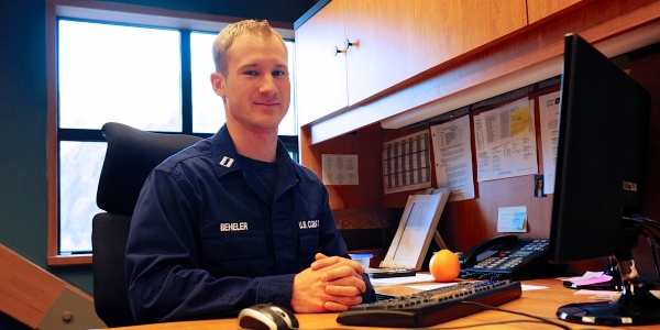 Lt. Nicholas Beheler, executive officer of the North Pacific Regional Fisheries Training Center, takes a moment for a photo in his office in Kodiak, Alaska, Wednesday, Jan. 16, 2013. In his off time Beheler volunteers with Kodiak Island Search and Rescue. U.S. Coast Guard photo by Petty Officer 1st Class Sara Francis.