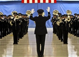 Air Force Col. Larry H. Lang, commander of the Air Force Band, conducts as the band plays the "U.S. Air Force Song" during an inaugural parade dress rehearsal on Joint Base Andrews, Md., Jan. 11, 2013