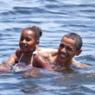 President Obama swims the gulf with his daughter.