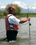 Thumbnail of USGS employees measuring streamflow with a wading rod