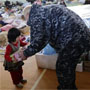 Man talking to child (U.S. Navy)