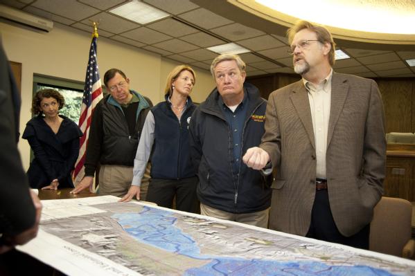 Officials look over a map of Minot, North Dakota.